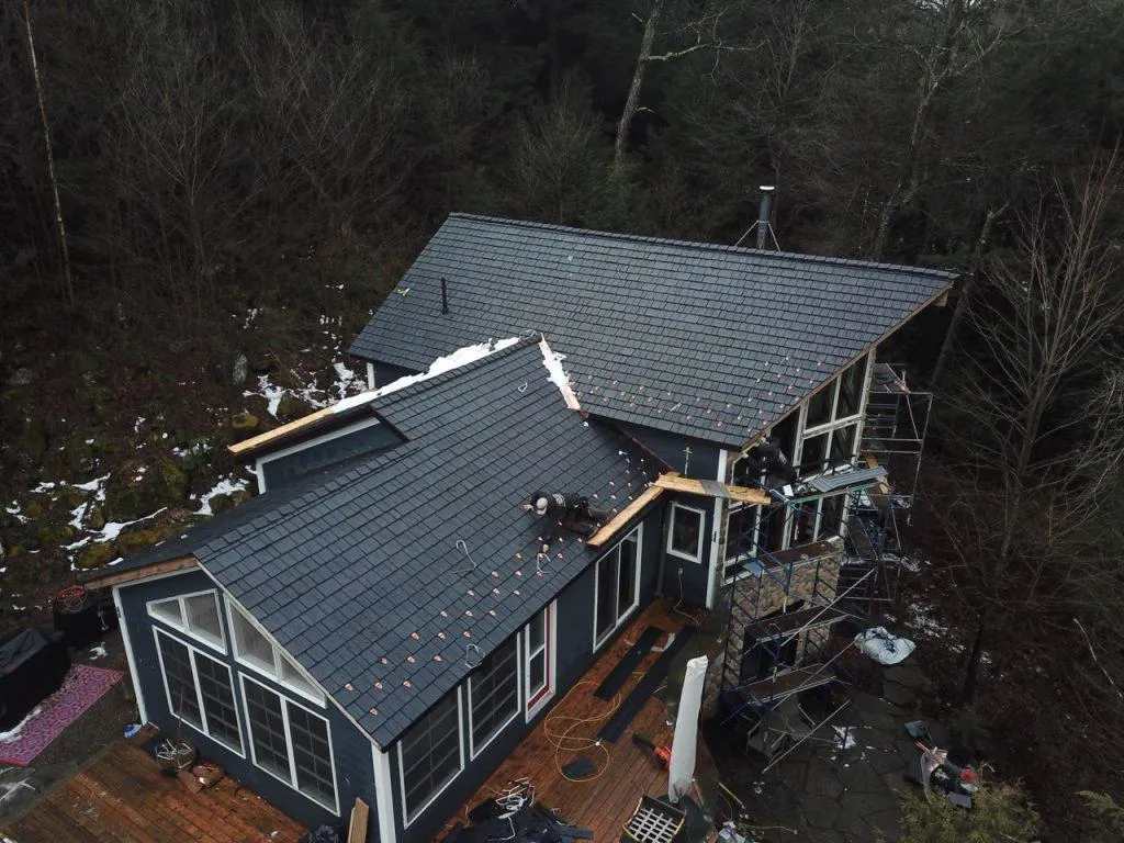 Side-by-side comparison of Enviroshake composite shake and standing seam metal roofing on Florida homes