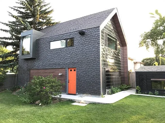 Sustainable roofing materials including recycled composite shingles and solar-integrated panels on a Florida home