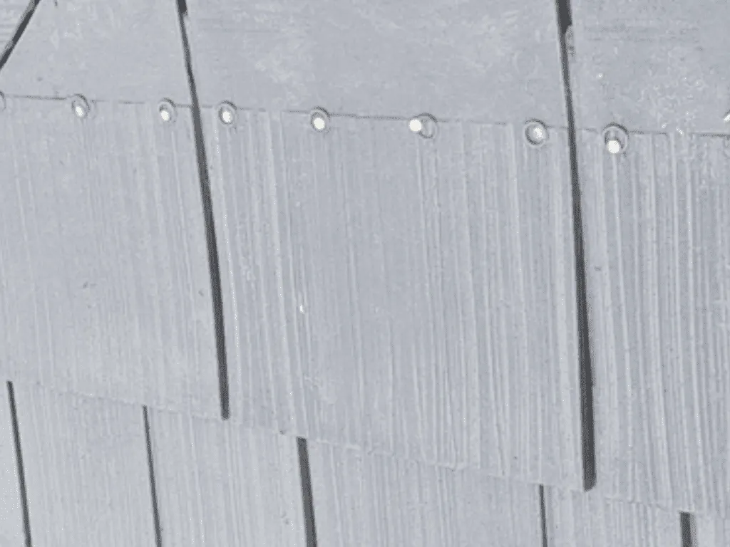 Close-up of galvanized and stainless steel roofing fasteners used in Florida coastal installations